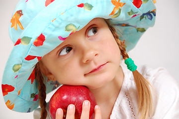 Image showing girl with hat and apple