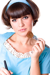 Image showing brunet woman with two make-up brushes 
