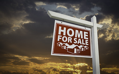 Image showing Red Home For Sale Real Estate Sign Over Sunset Sky