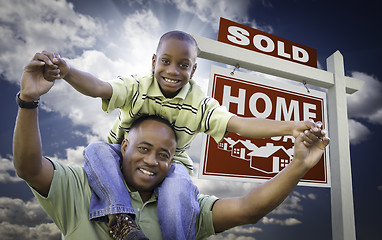 Image showing African American Father with Son In Front of Sold Home For Sale 