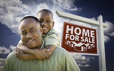 Image showing African American Father with Son In Front of Real Estate Sign