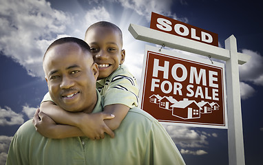 Image showing African American Father with Son In Front of Sold Home For Sale 