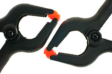 Image showing Red and black plastic clamps