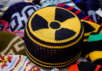 Image showing Nuclear radiation hazard sign on knitted hat