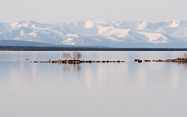 Image showing Stony island among lake