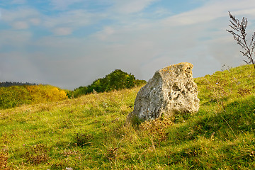 Image showing Single large stone on a slope