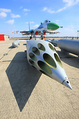 Image showing Rocket launcher and a fighter jet