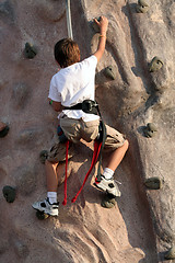 Image showing Kid climbing wall