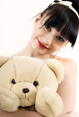 Image showing Young woman with teddy bear  