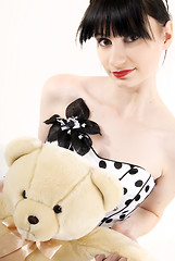Image showing Young woman with teddy bear 