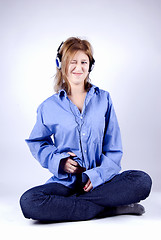 Image showing Young girl in headphones 