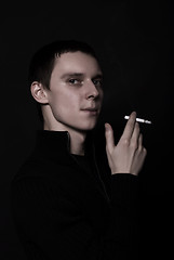 Image showing portrait of a young man with cigarette  