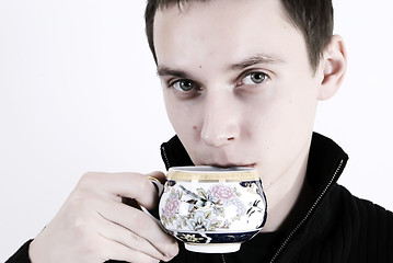 Image showing young man with a cup of tea