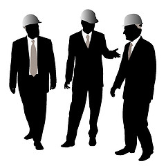 Image showing Three businessmen architects or engineers with protective helmet