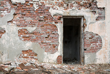 Image showing Old red brick wall with door