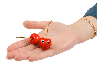 Image showing Two sweet cherries on palm