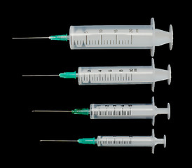 Image showing Four syringes