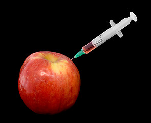 Image showing Red apple with a syringe