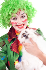 Image showing Female clown with a white rabbit