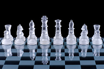 Image showing Macro shot of glass chess set against a black background