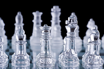 Image showing Macro shot of glass chess set against a black background