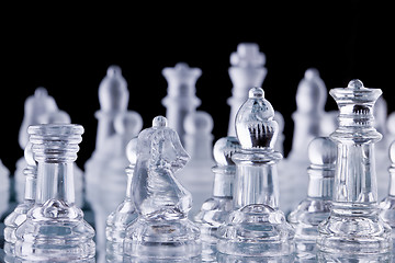 Image showing Macro shot of glass chess set against a black background