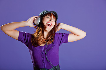 Image showing Beautiful woman listening music