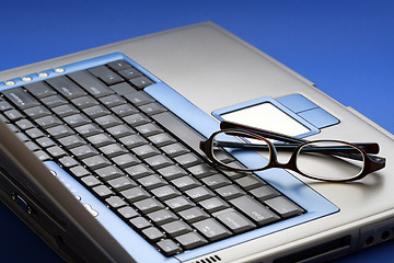 Image showing Glasses on laptop