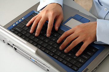 Image showing Hands on laptop
