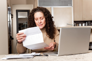 Image showing Woman paying bills