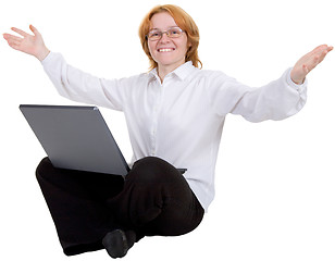 Image showing Woman sitting with the laptop on white