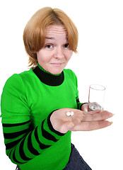 Image showing Girl with a glass and tablets