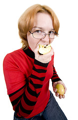 Image showing The girl eats an two apples