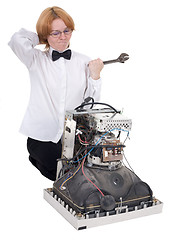 Image showing The girl repairing equipment