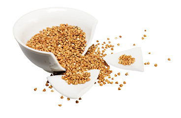 Image showing Broken white cup and buckwheat