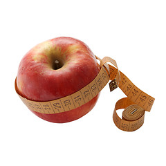 Image showing Red apple with measuring tape