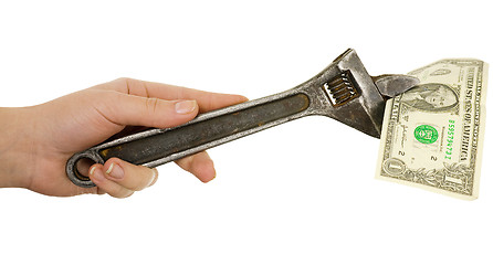 Image showing Wrench in a hand with dollar