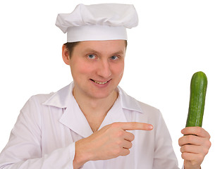 Image showing Cook with cucumber in hand