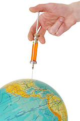 Image showing Syringe and terrestrial globe