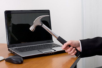 Image showing Hammer and the laptop