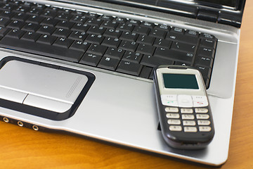 Image showing Mobile phone and keyboard