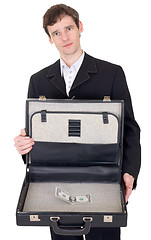 Image showing Man with suitcase containing dollar