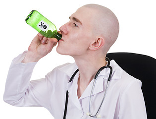 Image showing Man in doctor's smock with green bottle