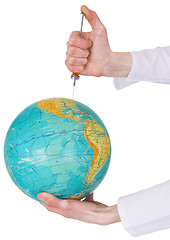 Image showing Terrestrial globe and syringe