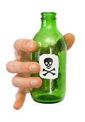 Image showing Male hand with green bottle pictured skull and crossbones