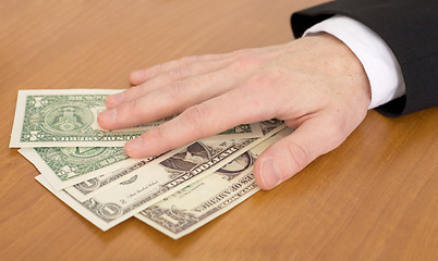 Image showing Man's hand over dollars