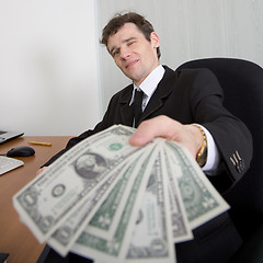 Image showing The artful businessman and money