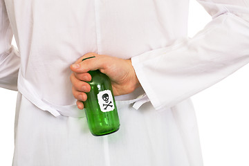 Image showing Hand with green bottle