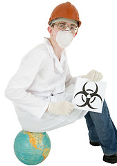 Image showing Scientist with poster biohazard sit on a globe