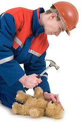 Image showing Labourer with bear and hammer